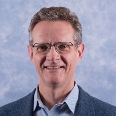 Dr John Carswell - Director